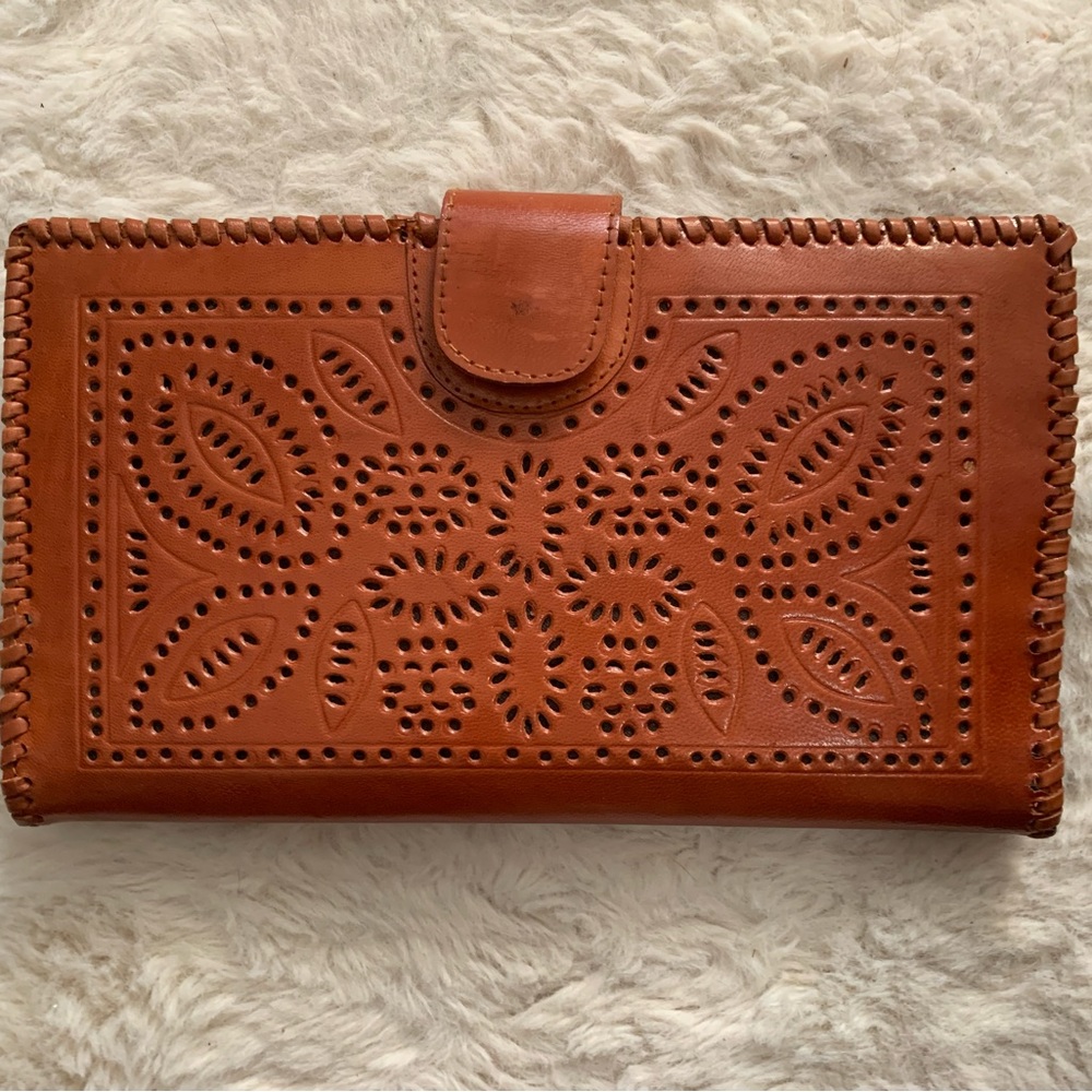Brown tooled leather clutch wallet